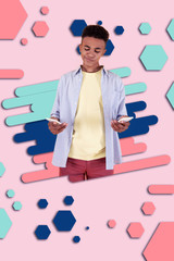 Electronic store. boy standing in front of graphic background having hesitations while choosing new smartphone in electronic store