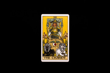 An individual major arcana tarot card isolated on black background. The Chariot.