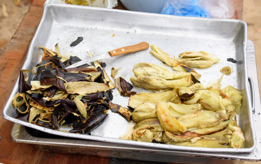 Baked eggplants, peeled from the skin on a metal baking sheet