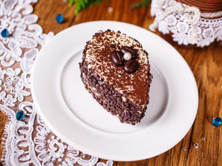 A piece of coffee cake with a white pearl