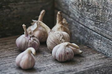 Few heads of garlic in a wooden box