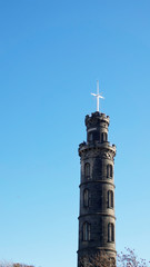 Fototapeta na wymiar The Nelson Monument on Calton Hill in Edinburgh on a bright autumn day.