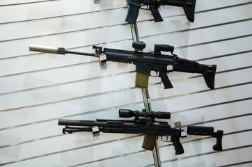 Gun wall rack with rifles