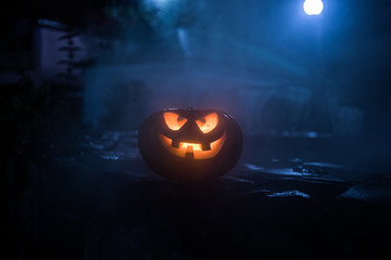 Halloween pumpkin. Carved Halloween pumpkin glowing in the dark.