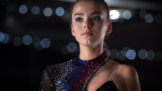 A figure skater lifts her head up and her performance is about to start.