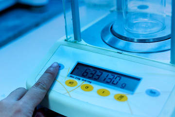 Blue shade color picture of balance in chemical laboratory