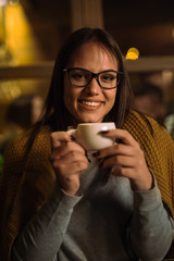Beautiful woman holding coffee