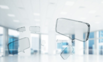 Concept of communication by glass empty chat icon on office back