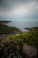 river flows to the sea ina a beautiful coast in Sardinia, Italy. Vertical