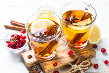 Autumn hot tea with lemon and spices