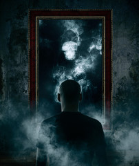 Mirror. Terrible ghost on dark smoke