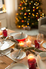 christmas, holidays and eating concept - table served for festive dinner at home
