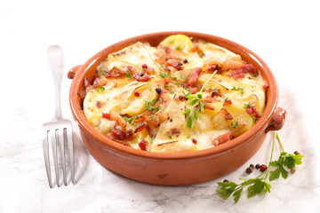tartiflette, baked potato, bacon and cheese