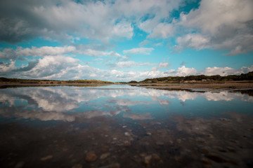 Beautiful panorama with the Mediterranean sea in Sardinia, Italy. crystal and colorful water. Beautiful sky. Travel life.