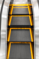 technology and transportation concept - close up of escalator
