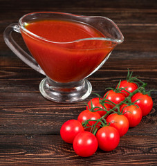 chili tomatoes and tomato on wooden background