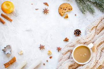 white knitted scarf and christmas decorations top view