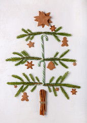 Christmas tree made of fir branches on white background.