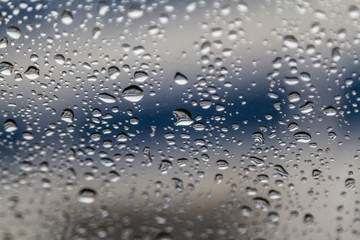 rain drops on car glass, abstract background