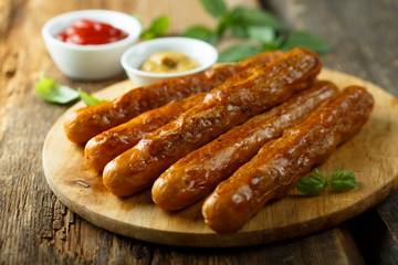 Homemade fried sausages with sauces