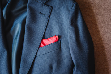 Formal wear - male suit and pocket tissue on a hanger