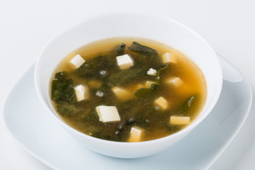 one miso soup in the white bowl