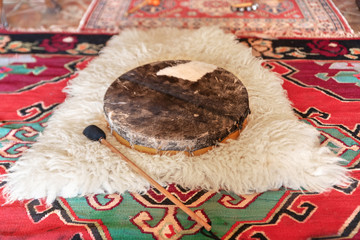 Traditional drum on white carpet
