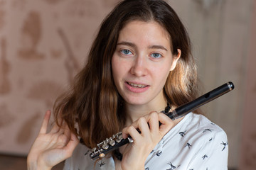Beautiful young woman with flute Genre portrait of young beautiful girl