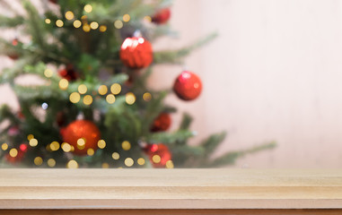 Naklejka na ściany i meble Christmas xmas tree with festive bokeh light holiday on wood table blur background.