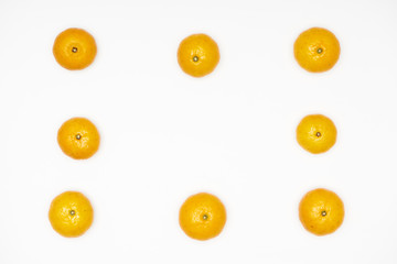 Fototapeta premium Small tangerines isolated on white background.
