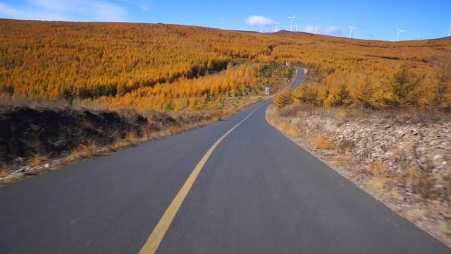 Driving on the chinese Route 66(grass skyline) at autumn, Zhangjiakou, China