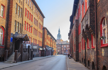 Street in the Historic Mining District of Nikiszowiec in Katowice in Polish Silesia. The street is adjoined by  red-brick houses in which the miner's family lived