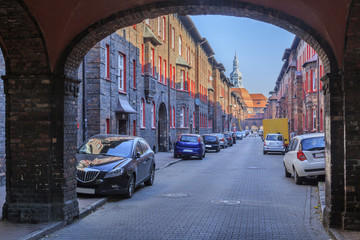 Street Św. Anna in Historic Mining District Nikiszowiec in Katowice in Polish Silesia. The street is adjoined by red-brick houses in which the miner's family lived - obrazy, fototapety, plakaty