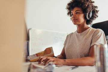 Female programmer typing data codes