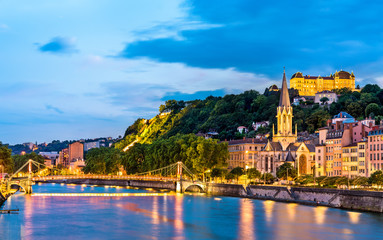 St. George Church and a footbridge across the Saone in Lyon, France