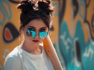 Portrait beautiful girl with baseball bat. Fashion makeup and hair style. Style goggles 