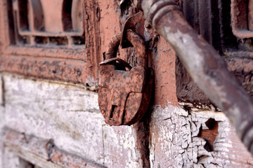 Old rusty padlock on the door