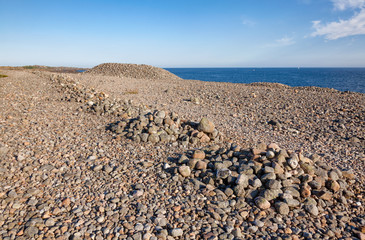 Cairns made of cobble deposits at Molen UNESCO Global Geopark Larvik Vestfold Norway Scandinavia