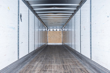 Interior view of empty semi truck dry van commercial trailer
