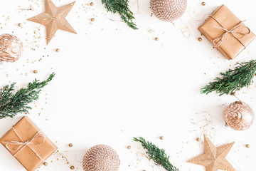 Christmas composition. Christmas gifts, fir tree branches, golden decorations on white background....