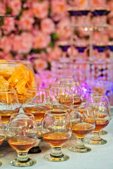 Glass glasses with colored drinks on the table. alcoholic drinks at the buffet