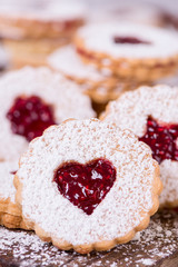Linzer cookies with raspberry jam close up view.