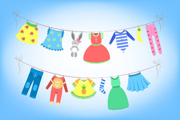 Cute baby clothes drying on the rope