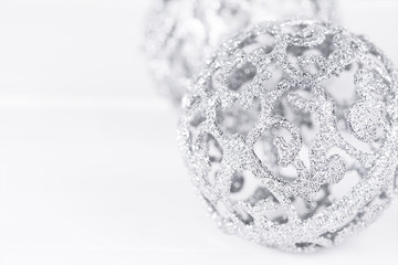 Big silver sparkle ornament bowls. Close view with empty space for text. Christmas card 