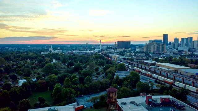 Atlanta Aerial v482 Hyperlapse crossing over residential and railway toward sunset 10/18