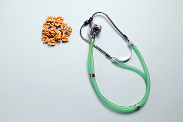Nuts and stetoksop. Heart health concept. Copy Space