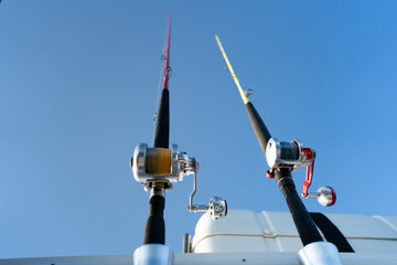 Closeup on fisherman rod on the ocean coast background