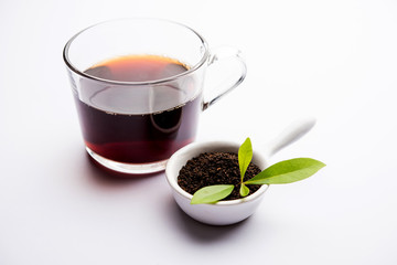 Black Tea Powder or dry dust with or without green leaf and served hot chai in a cup