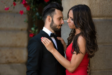 Portrait of an elegant fashion couple in love on a romantic date during a luxury banquet.