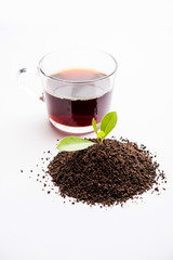 Black Tea Powder or dry dust with or without green leaf and served hot chai in a cup